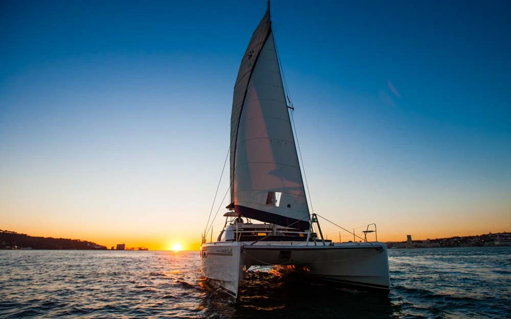 Sunset cruise on a catamaran boat in Lisbon